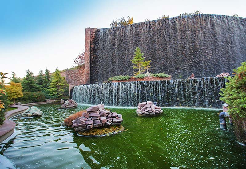  Milad Tower artificial waterfall , one of the recreational places near Espinas Palace - HotelOneClick