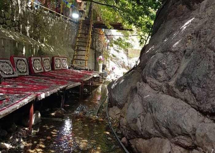 Darband Iranian restaurant over river in mountain - HotelOneClick
