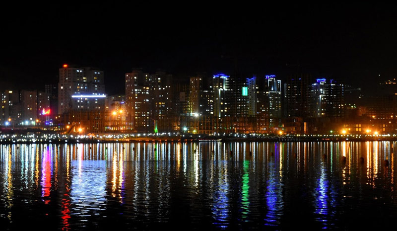 buildings around Chitgar Lake in the night