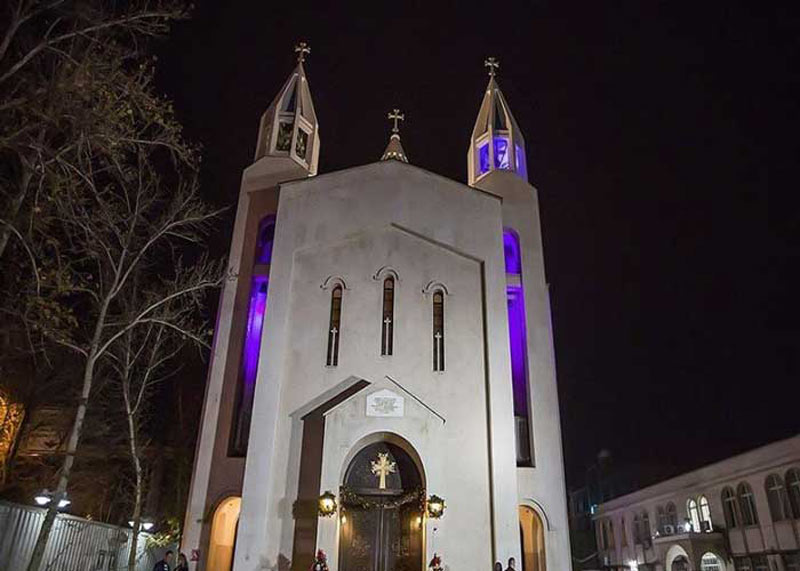 Entrance door of  Saint Sarkis Cathedral in Tehran at night - HotelOneClick