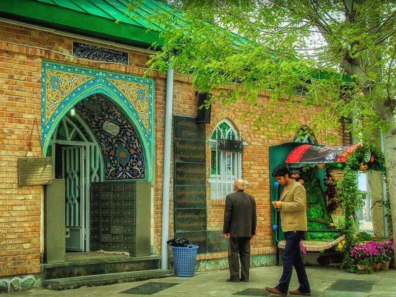 entrance door of Eynali and Zeynali Imamzadeh , one of the best religious site and mosques near  Parsian Azadi Hotel