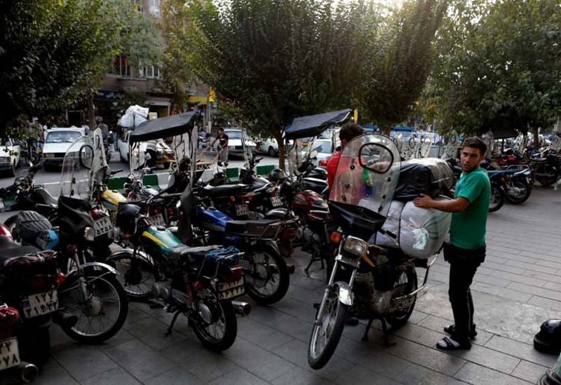 Transportation by Motorcycle in Tehran bazar